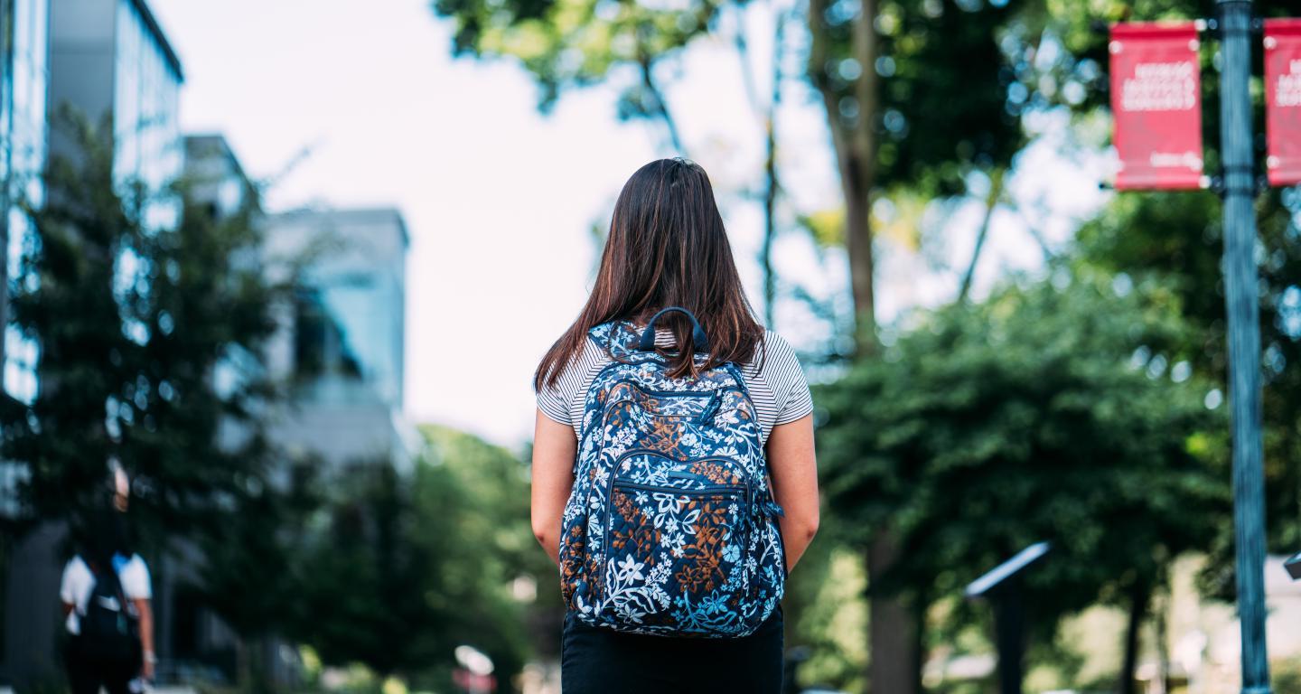 student walking on campus