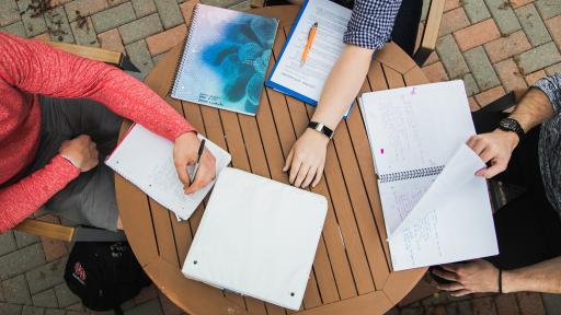 students looking over paperwork